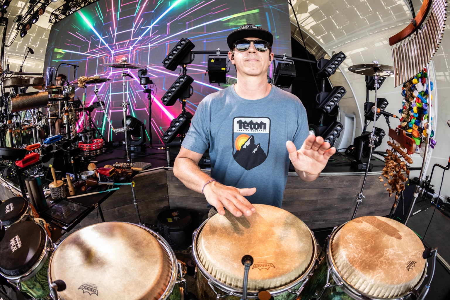 Will Phillips playing congas with his full live percussion setup