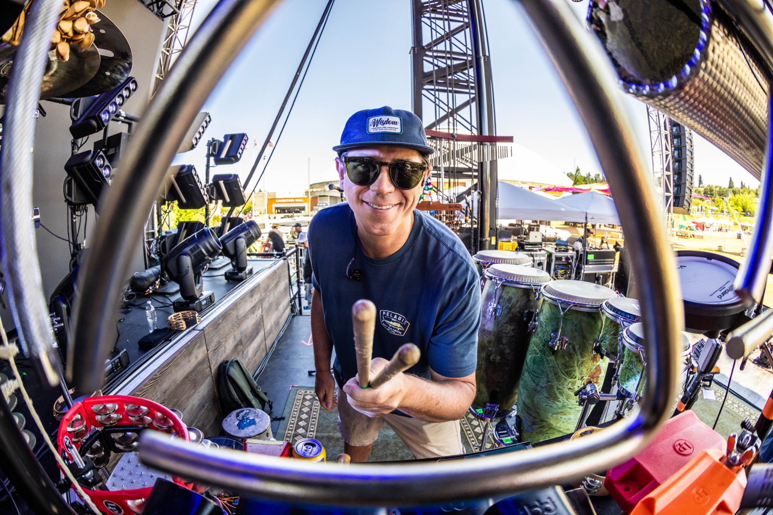 Will Phillips holding mallets inside his touring percussion rig